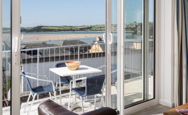 Balcony with sea view at Heron House, self catering cottage in Rock, Cornwall