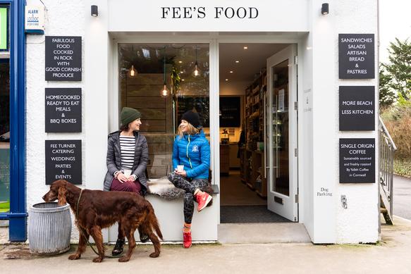 Fees food with some customers outside. Fees food supplies a range of delicious lunchtime snacks and homemade meals for a quick and easy dinner.